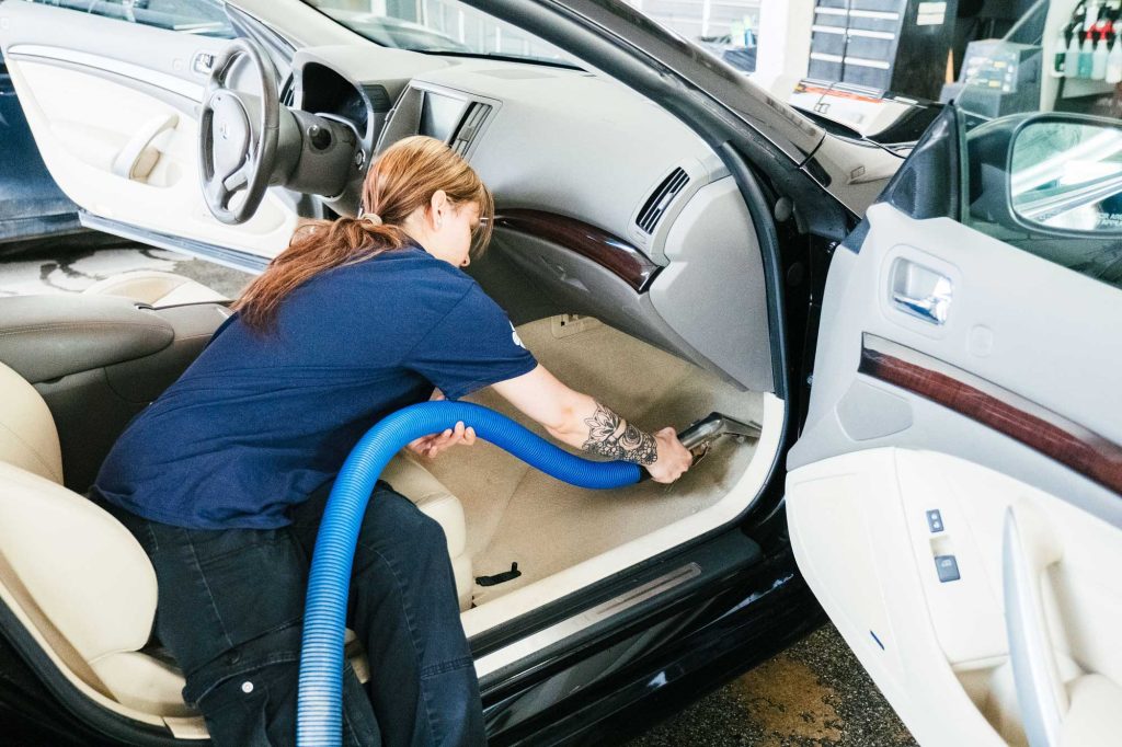 Vacuuming car interior